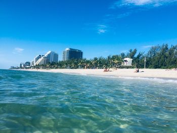 Scenic view of sea against blue sky
