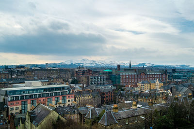 High angle view of buildings in city against sky