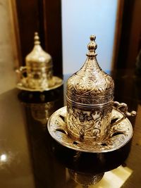 Close-up of old tea light on table