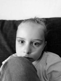Close-up portrait of innocent girl at home
