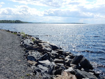 Scenic view of sea against cloudy sky