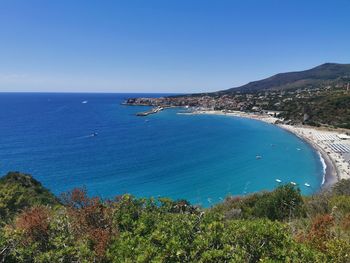 Scenic view of sea against clear blue sky