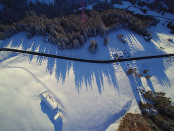 High angle view of frozen trees by swimming pool during winter