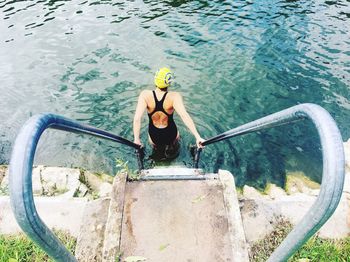 High angle view of man floating on sea