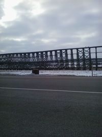 View of bridge against cloudy sky