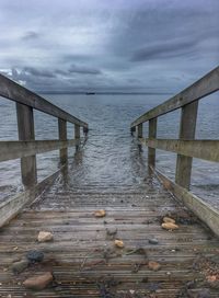 Pier over sea against sky