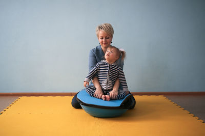 Portrait of boy playing with toy on table