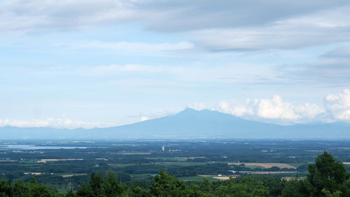 Scenic view of landscape and mountains against sky
