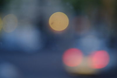 Defocused image of heart shape against sky at night