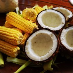 Close-up of corn on cobs with coconuts