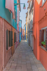 Narrow alley amidst buildings in city