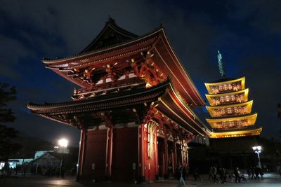 Facade of temple against cloudy sky