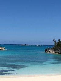 Scenic view of sea against clear blue sky