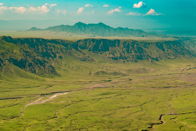 Valley against mountains at mount ol doinyo lengai in the ngorongoro conservation area, tanzania