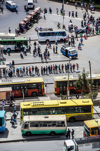 High angle view of people sitting on road against sky