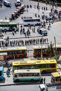 High angle view of people and vehicles on road