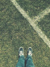 Low section of person standing on ground