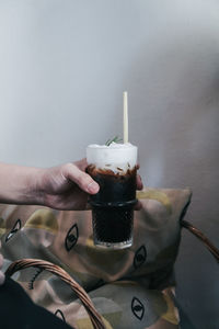 Close-up of hand holding ice cream