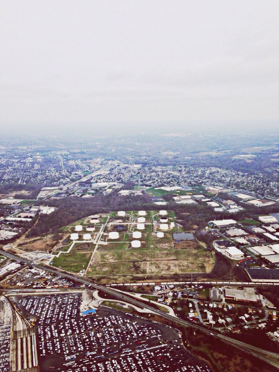 architecture, built structure, cityscape, building exterior, city, high angle view, crowded, aerial view, sky, residential district, landscape, residential structure, residential building, day, roof, no people, outdoors, weather, horizon over land, elevated view