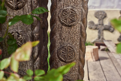 Close-up of cross on wood