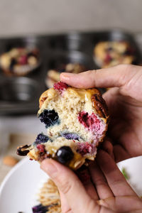 Close-up of hand holding cake