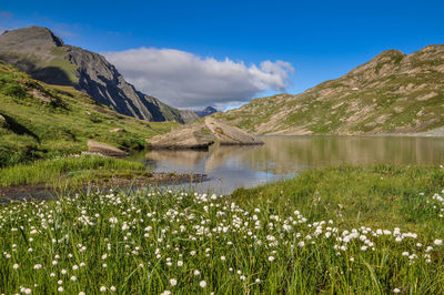 Scenic view of lake and mountains against sky