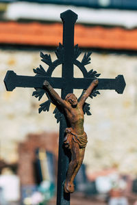 Close-up of cross in cemetery