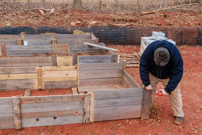 Rear view of man working at workshop