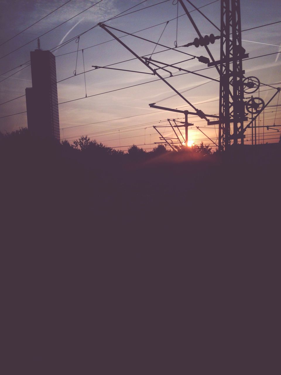 sunset, silhouette, power line, electricity pylon, power supply, electricity, connection, sun, sky, fuel and power generation, cable, orange color, technology, power cable, dark, sunlight, nature, no people, dusk, tranquility