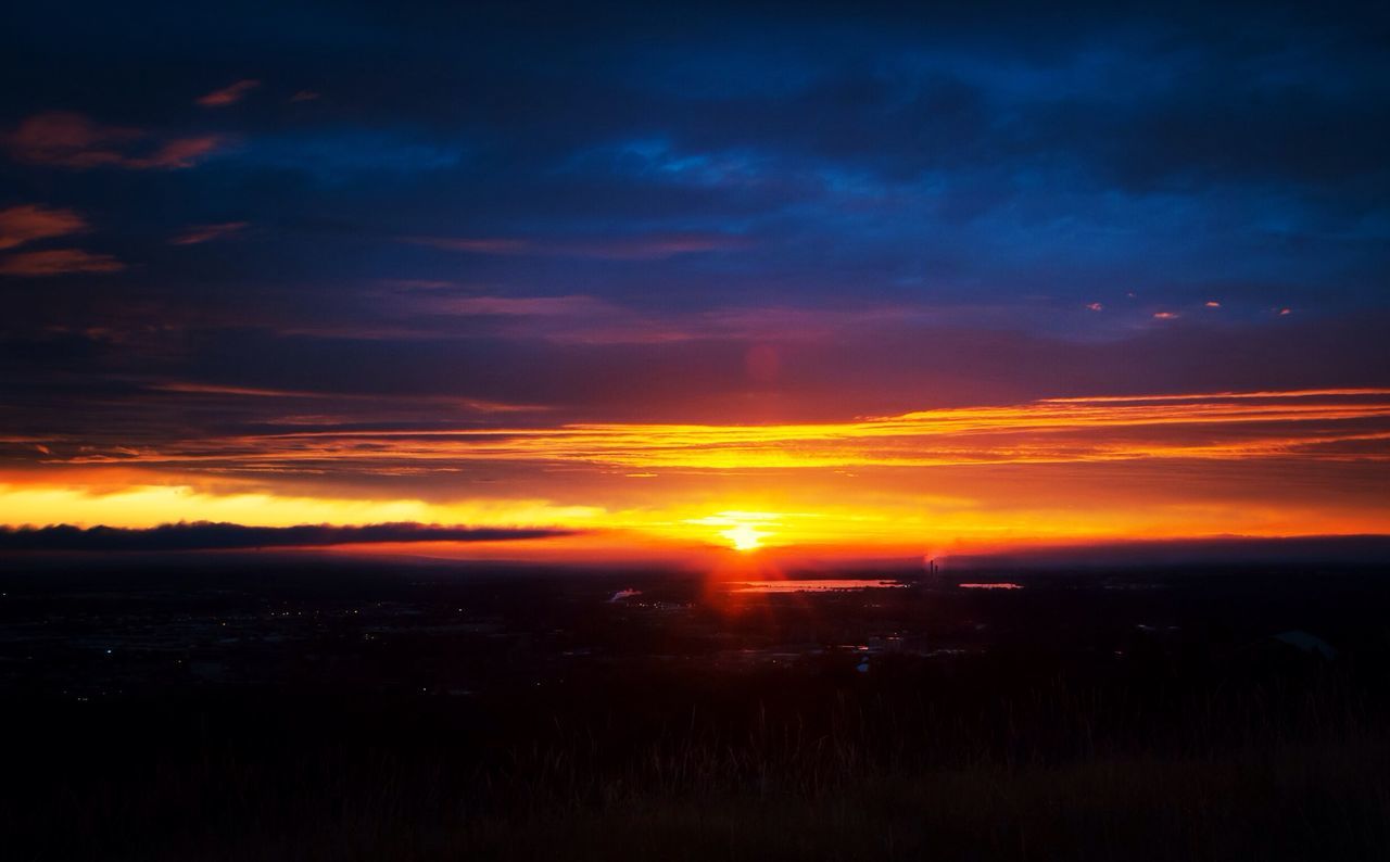 sunset, orange color, sun, scenics, sky, beauty in nature, tranquil scene, cloud - sky, tranquility, idyllic, silhouette, landscape, dramatic sky, nature, cloud, sunlight, moody sky, atmospheric mood, majestic, sunbeam