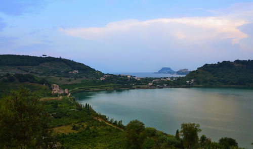 Scenic view of landscape against cloudy sky