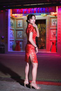 Portrait of beautiful asian woman wearing red dress in chinese new year festival.