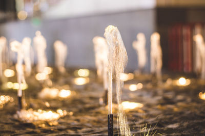 Close-up of illuminated lighting equipment at beach