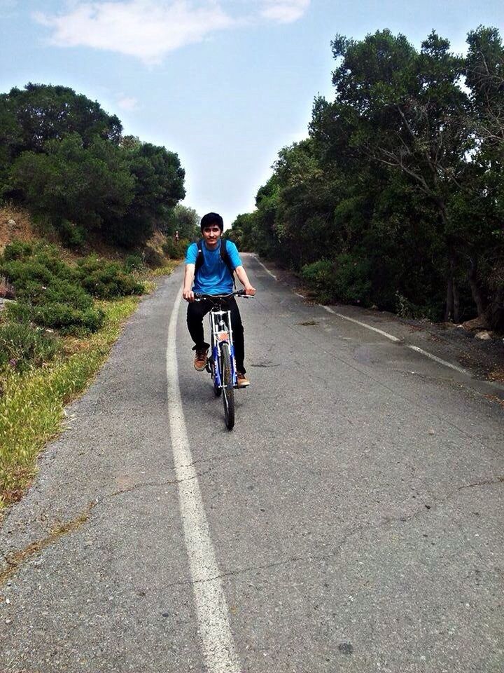 transportation, the way forward, road, tree, full length, lifestyles, riding, leisure activity, land vehicle, bicycle, rear view, mode of transport, diminishing perspective, men, cycling, sky, casual clothing, vanishing point