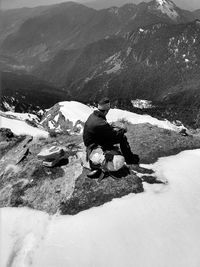 Man on rock in mountains