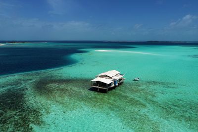 High angle view of stilt house in sea