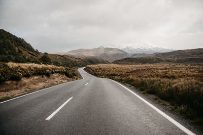 Road amidst landscape against sky