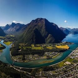 Aerial view of lake and mountains against sky