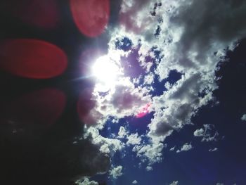 Low angle view of sun in sky