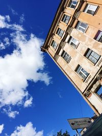 Low angle view of building against blue sky