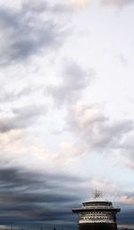 Low angle view of historical building against cloudy sky