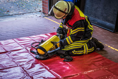 High angle view of child on floor