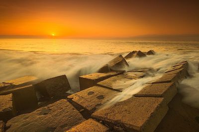 Scenic view of sea at sunset