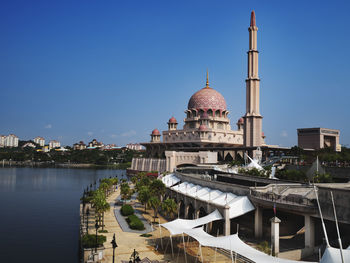View of buildings in city against clear sky