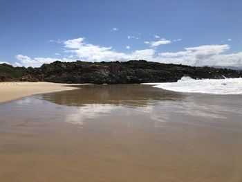 Scenic view of beach against sky