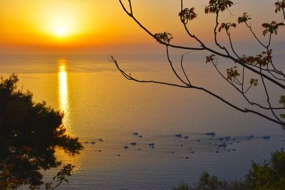 Scenic view of sea against sky at sunset