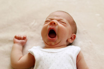 Close-up of baby girl yawning