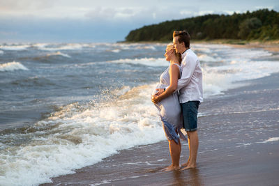 Couple standing on beach