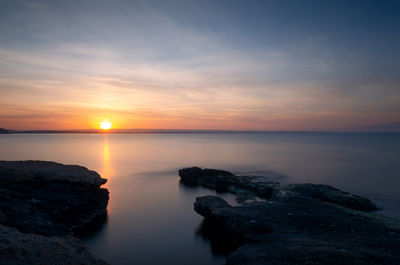 Scenic view of sea against sky during sunset