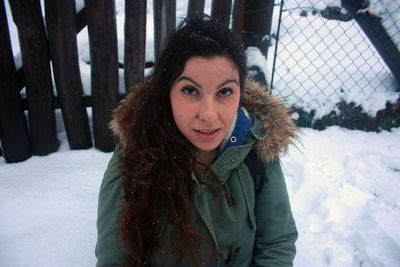 Portrait of woman in snow during winter